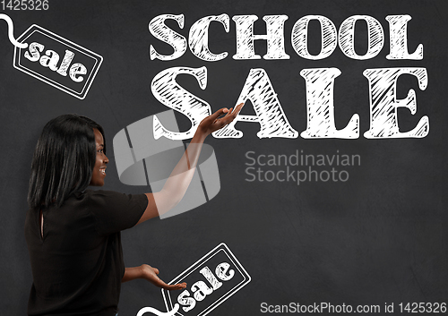 Image of Half-length close up portrait of young woman, school sale