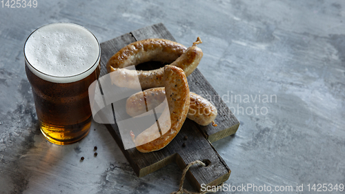 Image of Glass of beer on white stone background