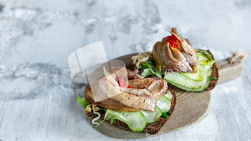 Image of Close up photo of meat snacks on stone background