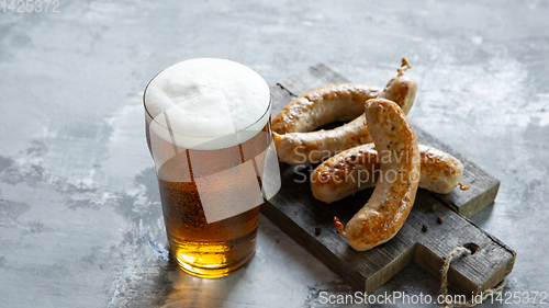 Image of Glass of beer on white stone background