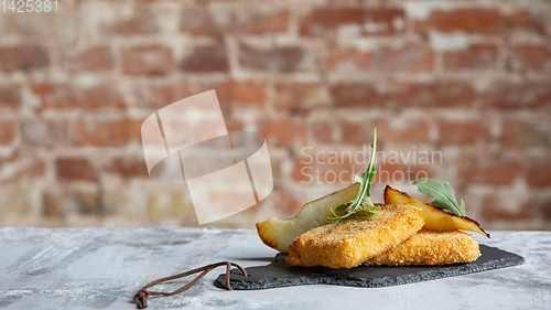 Image of Close up photo of meat snacks on stone background