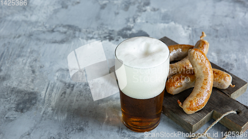 Image of Glass of beer on white stone background