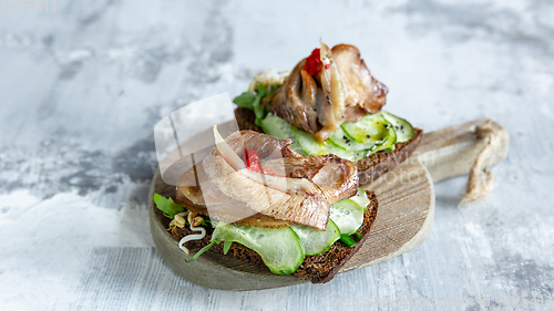 Image of Close up photo of meat snacks on stone background