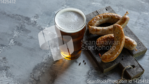 Image of Glass of beer on white stone background