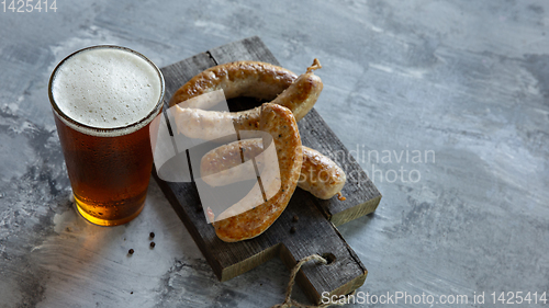 Image of Glass of beer on white stone background