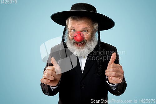 Image of Portrait of an senior jewish man celebrating red nose day