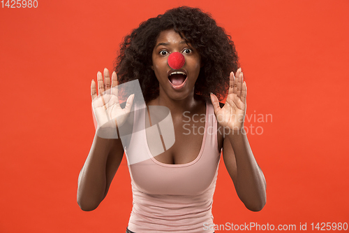 Image of Portrait of young african-american woman celebrating red nose day