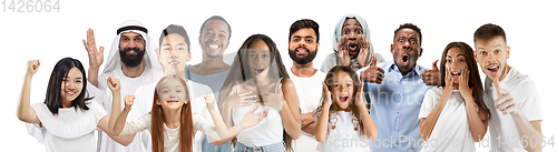 Image of Portrait of young people looks astonished and happy on white background