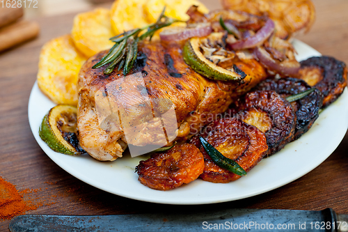 Image of roasted grilled BBQ chicken breast with herbs and spices 