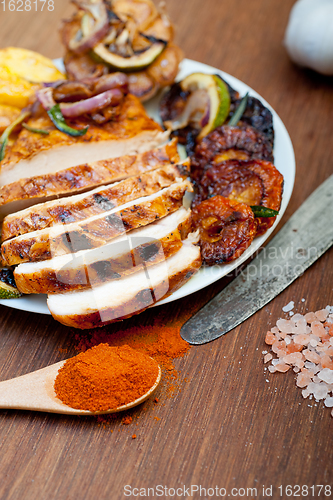 Image of roasted grilled BBQ chicken breast with herbs and spices 