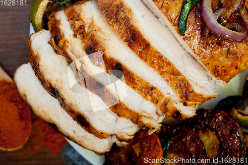 Image of roasted grilled BBQ chicken breast with herbs and spices 