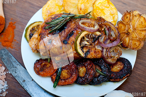 Image of roasted grilled BBQ chicken breast with herbs and spices 