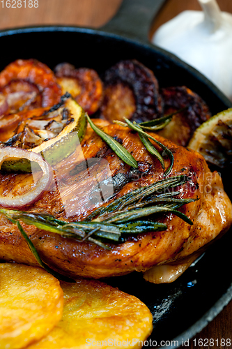 Image of roasted grilled BBQ chicken breast with herbs and spices 