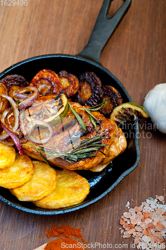 Image of roasted grilled BBQ chicken breast with herbs and spices 