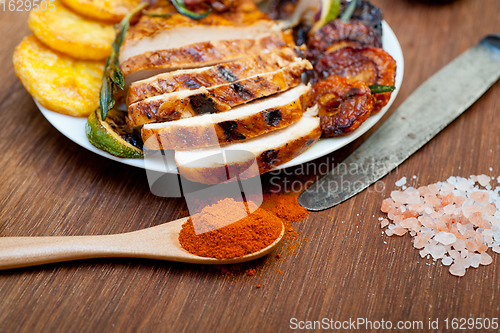 Image of roasted grilled BBQ chicken breast with herbs and spices 