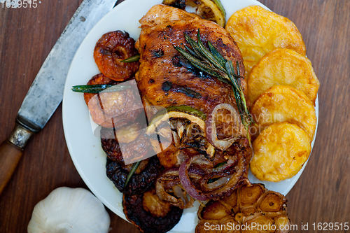 Image of roasted grilled BBQ chicken breast with herbs and spices 