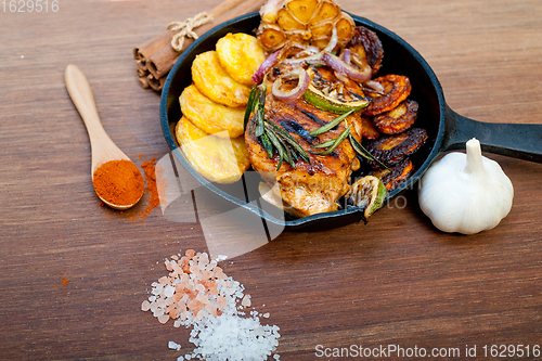 Image of roasted grilled BBQ chicken breast with herbs and spices 