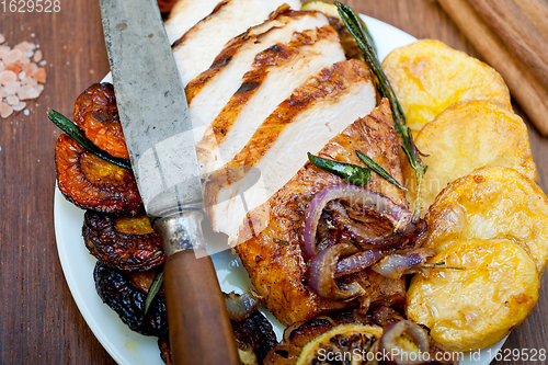 Image of roasted grilled BBQ chicken breast with herbs and spices 