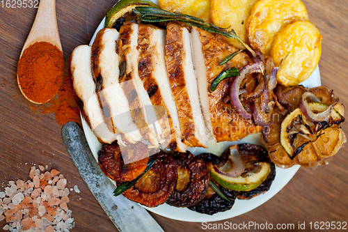 Image of roasted grilled BBQ chicken breast with herbs and spices 