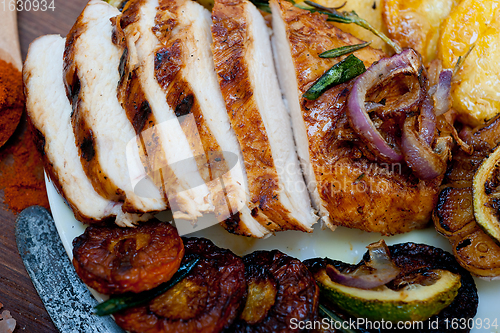 Image of roasted grilled BBQ chicken breast with herbs and spices 