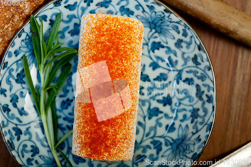 Image of French cheese and fresh  baguette on a wood cutter
