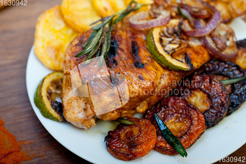 Image of roasted grilled BBQ chicken breast with herbs and spices 