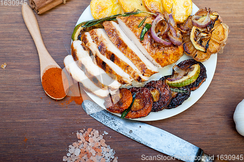 Image of roasted grilled BBQ chicken breast with herbs and spices 