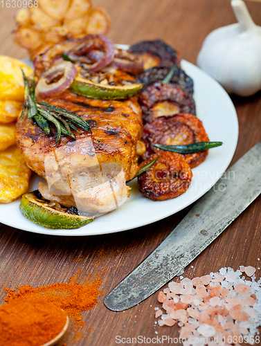 Image of roasted grilled BBQ chicken breast with herbs and spices 