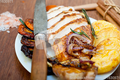 Image of roasted grilled BBQ chicken breast with herbs and spices 