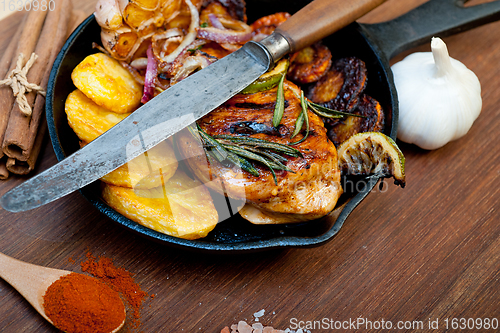 Image of roasted grilled BBQ chicken breast with herbs and spices 