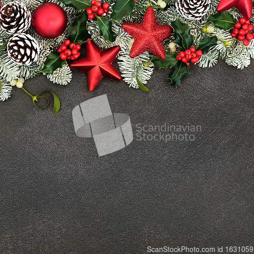 Image of Festive Background with Red Star Baubles and Winter Flora