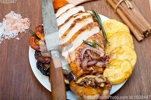 Image of roasted grilled BBQ chicken breast with herbs and spices 