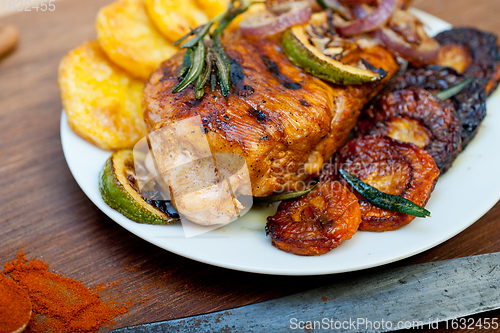 Image of roasted grilled BBQ chicken breast with herbs and spices 