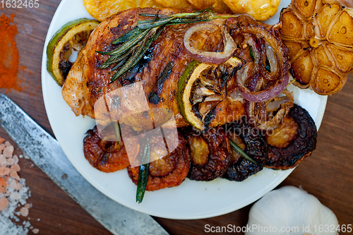 Image of roasted grilled BBQ chicken breast with herbs and spices 