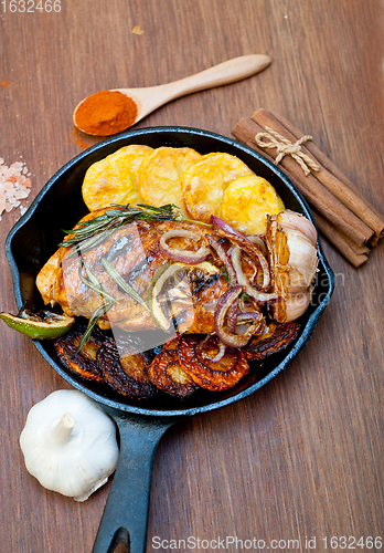 Image of roasted grilled BBQ chicken breast with herbs and spices 