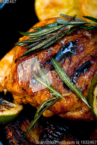 Image of roasted grilled BBQ chicken breast with herbs and spices 
