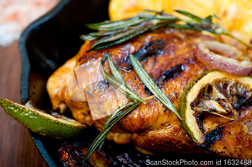 Image of roasted grilled BBQ chicken breast with herbs and spices 
