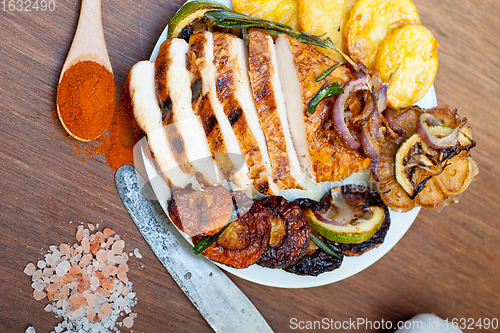 Image of roasted grilled BBQ chicken breast with herbs and spices 