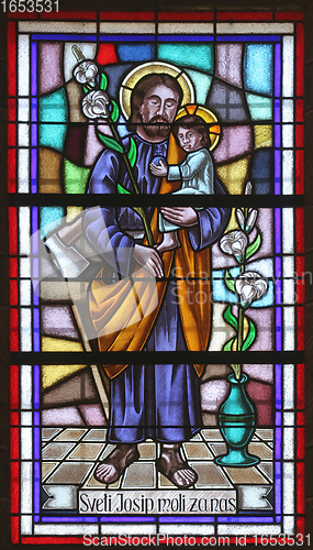 Image of Saint Joseph holding baby Jesus