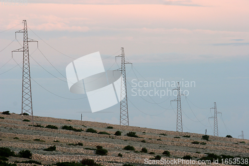 Image of Power lines and array of electric pylons