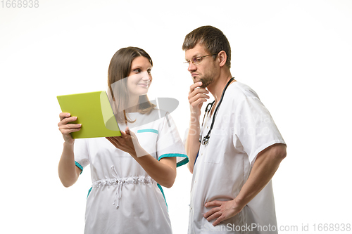 Image of Doctor grimaces at patient test results