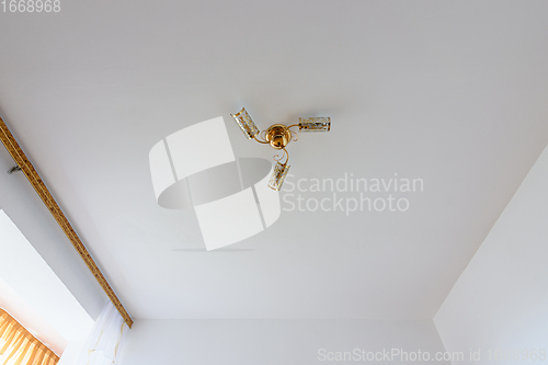 Image of White plastered ceiling in the interior of a room with painted walls