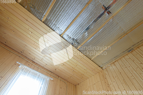 Image of Clapboarding of the ceiling and walls from the inside of a wooden house