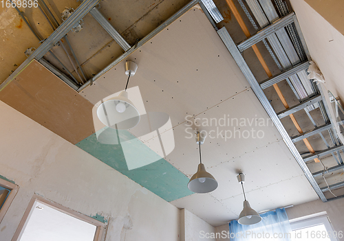 Image of Unfinished two-level plasterboard ceiling in the interior of a room in a new building