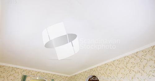 Image of White plastered ceiling of a large room in the house