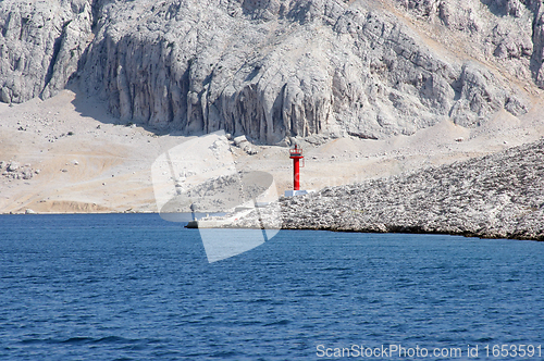 Image of Red see light on island with mountain background.