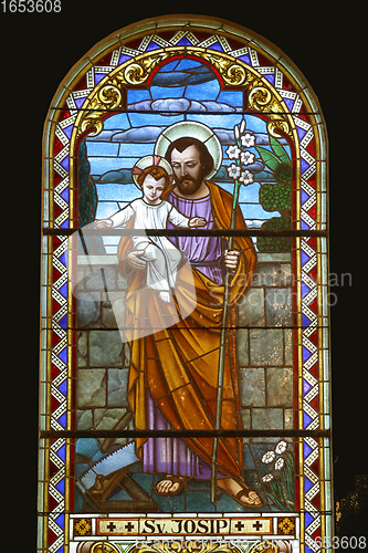 Image of Saint Joseph holding baby Jesus