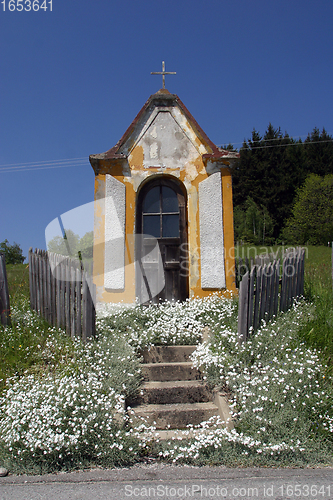 Image of Village chapel in summer countryside against blue sky, Pohorje, Slovenia