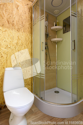 Image of The interior of a modest small bathroom in a country house