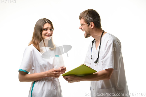 Image of The intern is shocked by the doctor screaming at her
